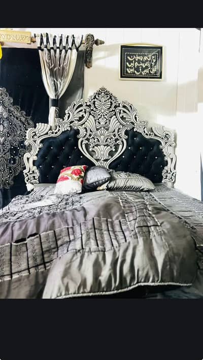 bed with side tables and dressing.