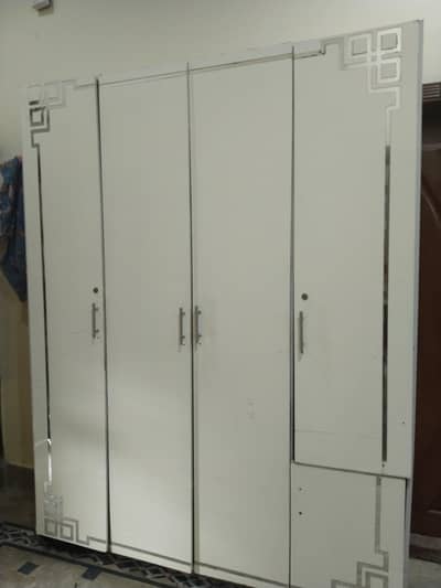 three portion wardrobe in white color