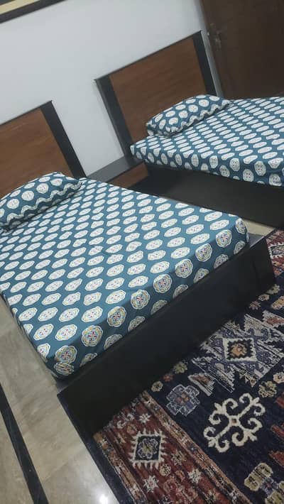 2 single beds with matress