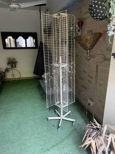 Roller shelf for shop items for hanging