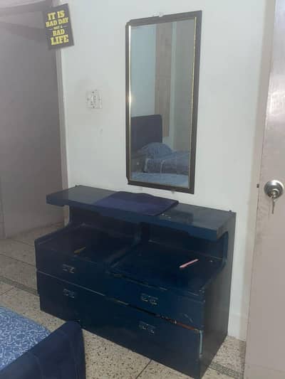 2 single beds with one side table and dressing tabel