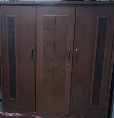 King size bed with wardrobe and dressing table.