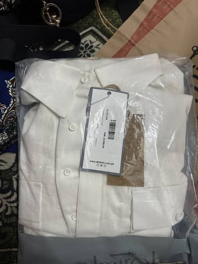 XL size Kurta Trouser in white color.