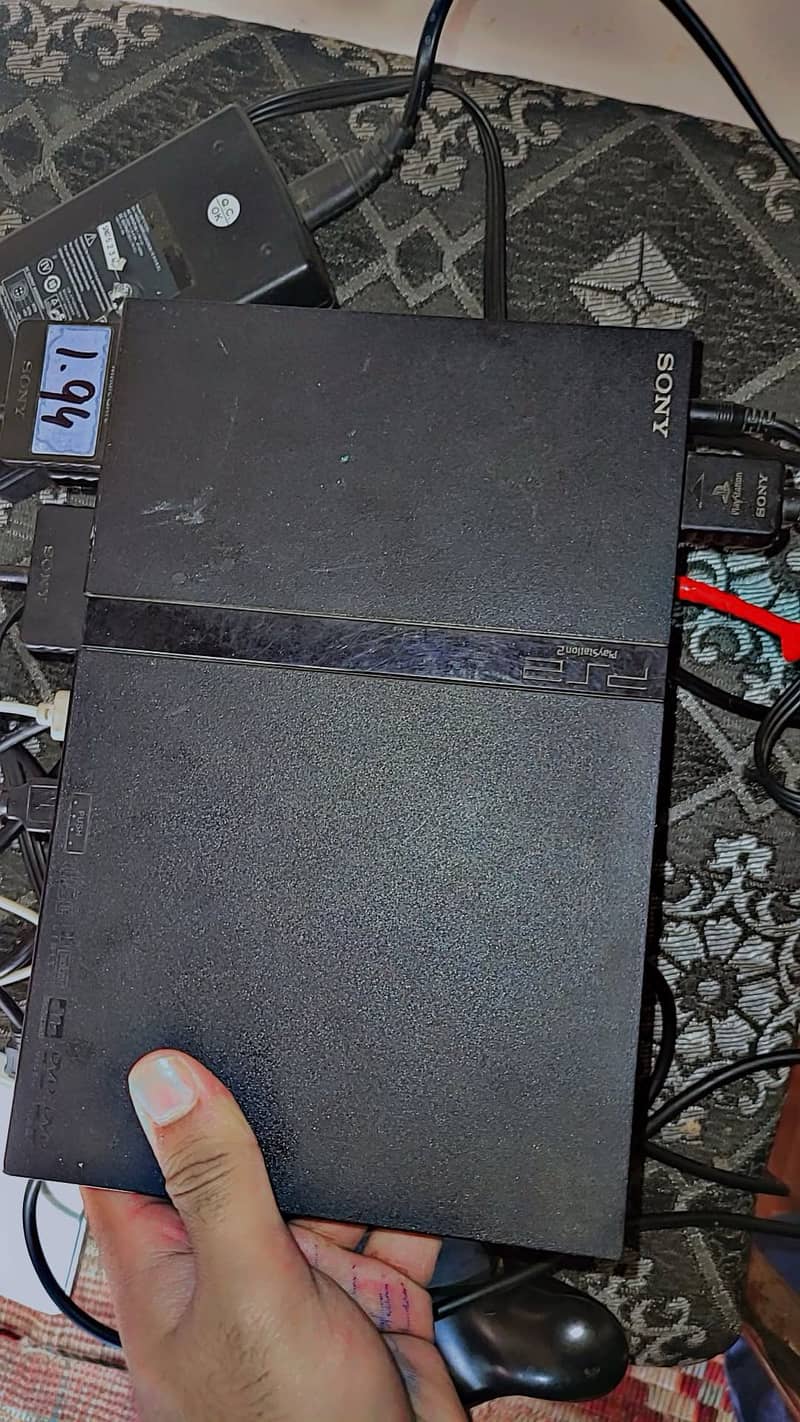 PS2 with 2 controlars 7