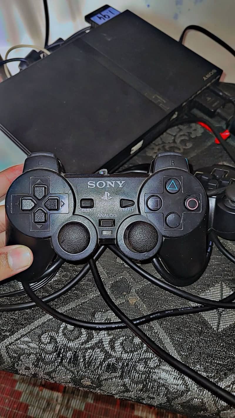PS2 with 2 controlars 10