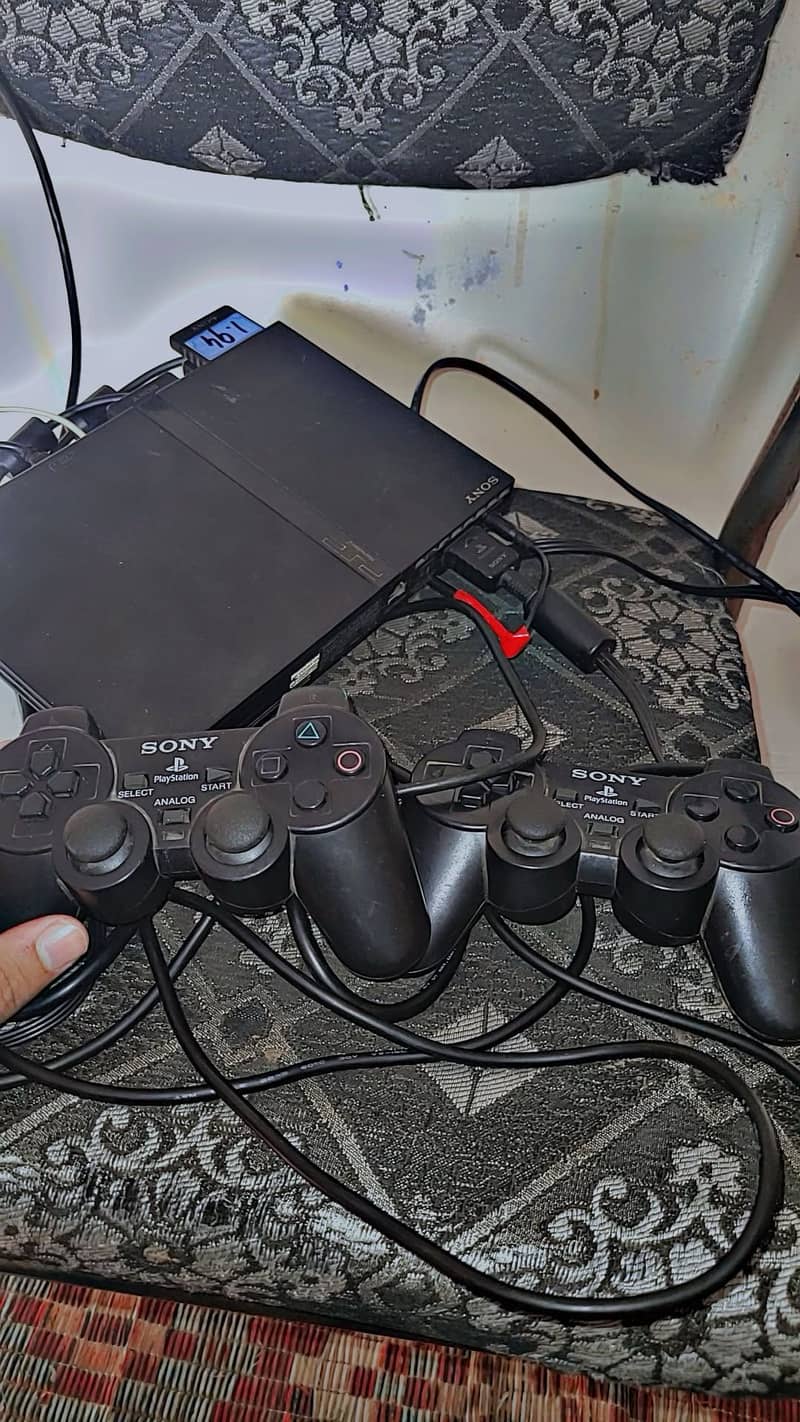 PS2 with 2 controlars 11