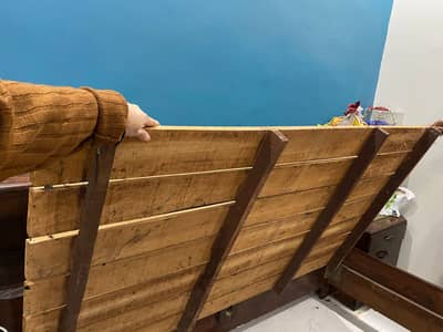 Wooden bed set with two side tables.