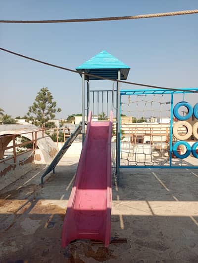 swing, slide and rock climbing