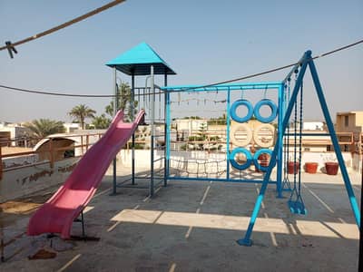 swing, slide and rock climbing