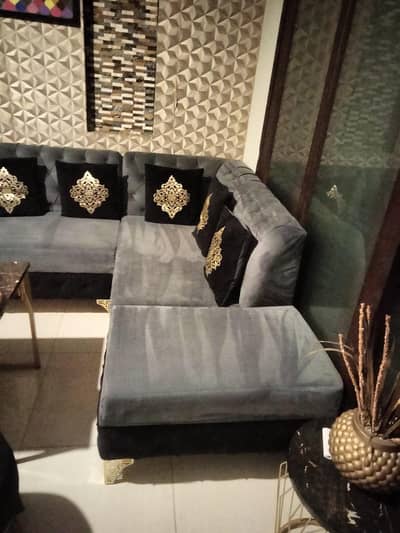 This is L-Shape sectional sofa set with black and gold essent pillows.