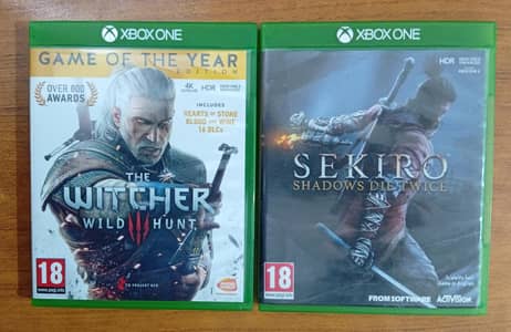 Sekiro and Witcher 3 GOTY edition game discs for Xbox One