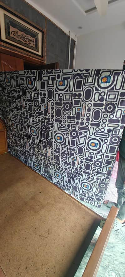 Wooden bed with molty foam