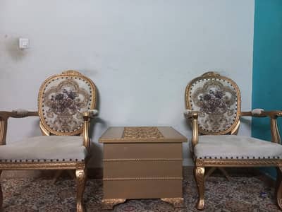 Bedroom chairs with a coffee table