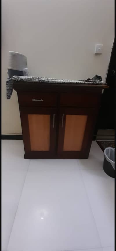 Iron stand with storage cabinet