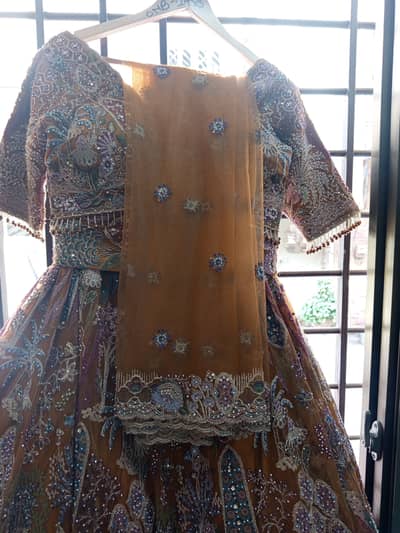 A heavy bridal dress (lehnga and choli) ready to wear.
