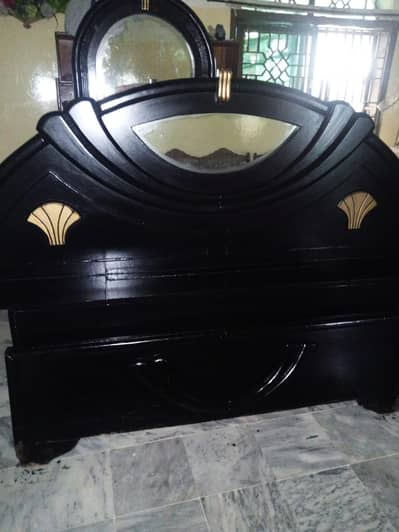 king size bed and said table and dressing table