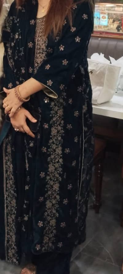 This velvet suit is zinc in color, featuring a rich, elegant texture t