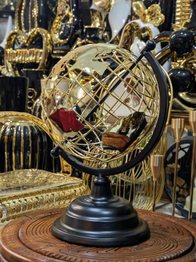 gold metal globe table showpiece.