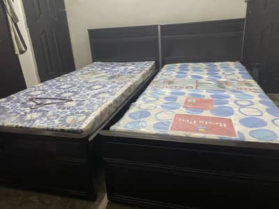 2 single beds with mattress