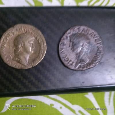 There are eight old coins for sale.