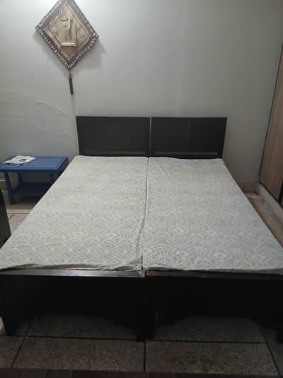2 Single beds with mattresses