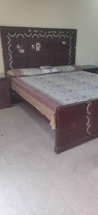 bed with its side tables and couch