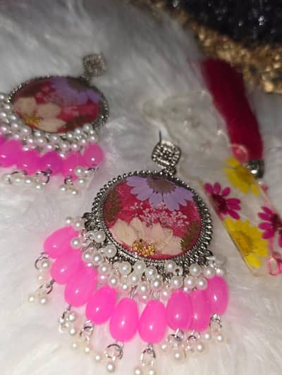 resin jhumkas with real flowers preserved