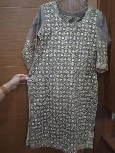 Beautyfull  net stiched cloth with mirror  work very gracefull to wear