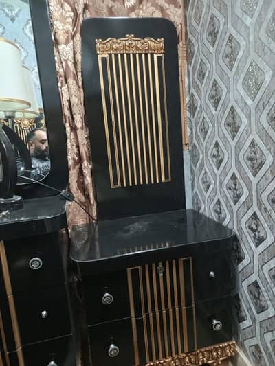 beautiful bed with 2 side tables and dressing