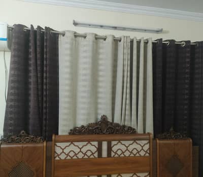 3 Separate curtains, 1 purple + off white, 1 green, 1 golden