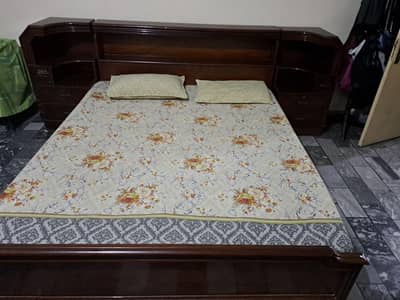 bed with side tables and dressing table