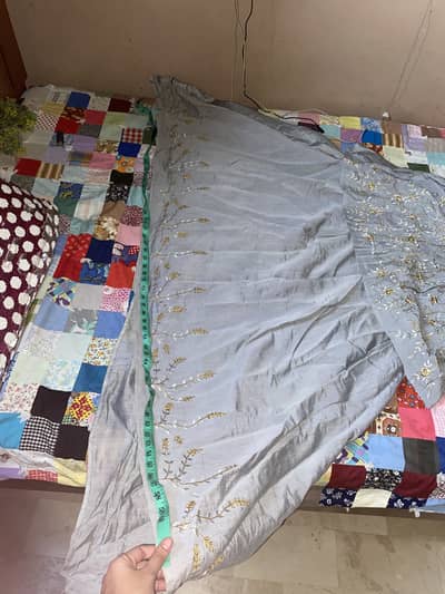 Beautiful long tail golden silver embrioded maxi.