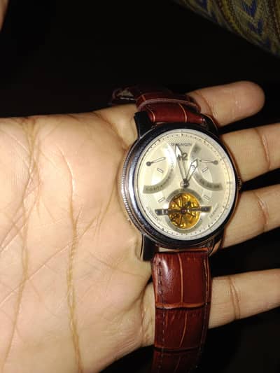 Guanqin Tourbillion watch. Elite class watch with day and date.