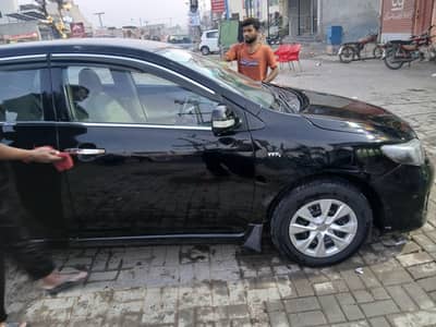 Corolla Nov 2011 Black in Dr home used car. Well maintained.