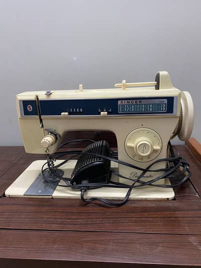 ORIGINAL SINGER sewing embroidery machine works perfectly.