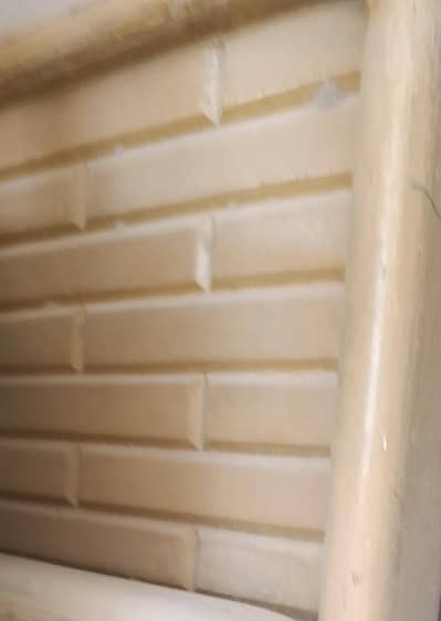 Two single wooden beds