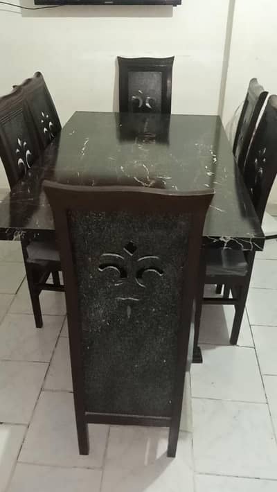 wooden dining table with six wonderfull chairs