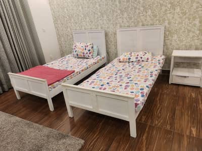 2 White Single Beds with 6-Inch Mattresses + Side Table – Good Deal