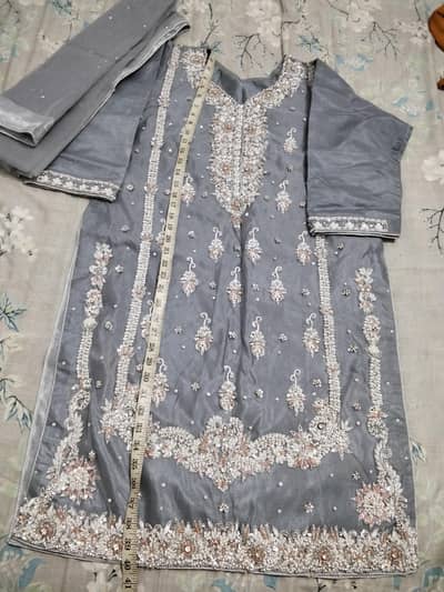 formal dress for part wear or weddings with new untouched sweaters.