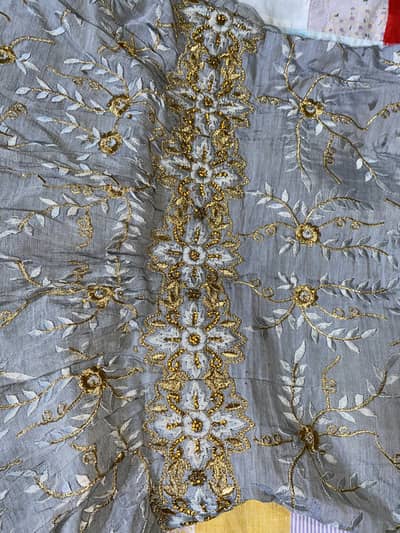 Beautiful long tail heavy embroidered golden silver maxi.