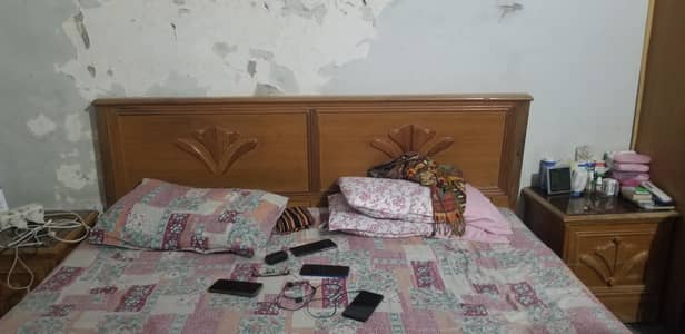 standard size bed with side table