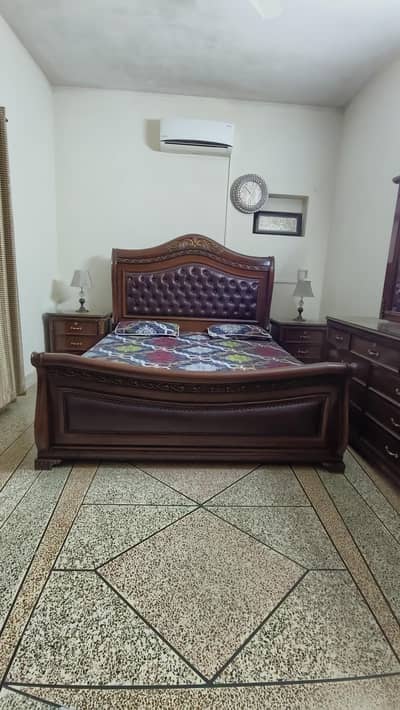 king size double bed with 2 side tables and dressing table