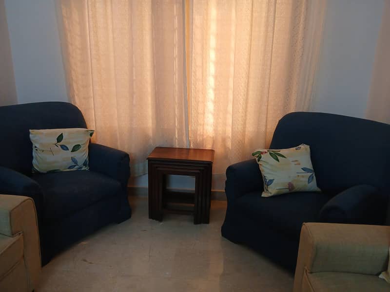 Two 1 seater Sofas available 1