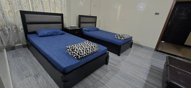 Excellent Condition Two single bed with mattresses and site table