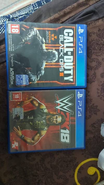 Ps4 game discs. Call of duty black ops 3 and wwe 2k18