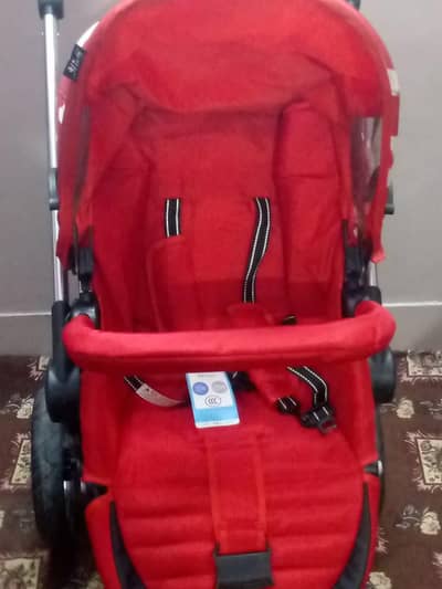 foldable baby stroller with a snack tray.