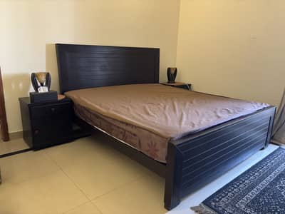 Slightly used bed with mattress and side tables for sale