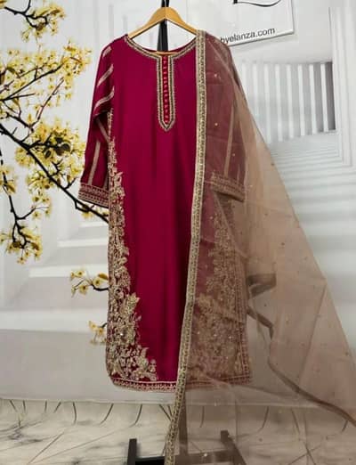 This is red raw silk pishwas featuring intricate gold embroidery