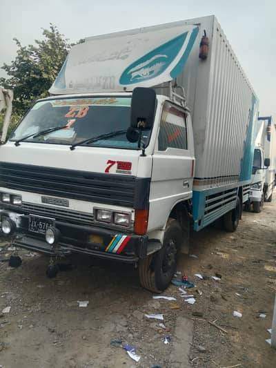 Goods transport movers packer house shifting mazda container shahzore