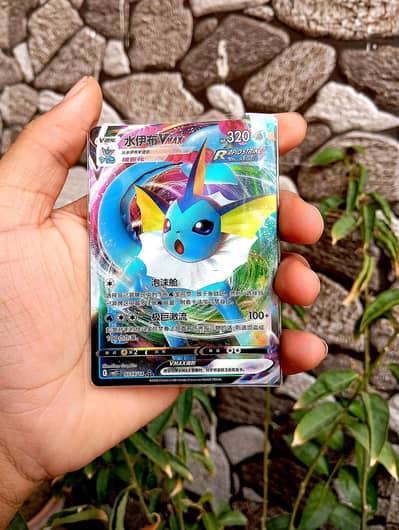 orignal tcg pokemon cards both are rare cards veporeon and leafeon .